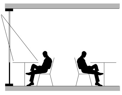 Silouhette of person sitting aginst glass